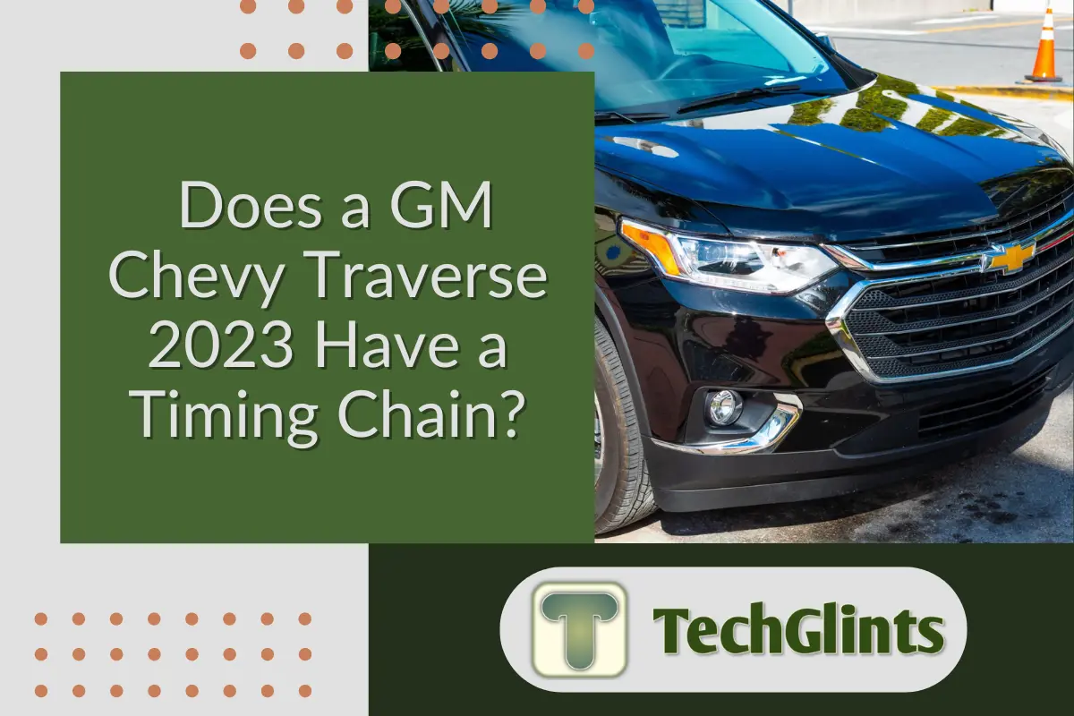 Front view of a black GM Chevy Traverse 2023 parked outdoors, accompanied by a text overlay asking, 'Does a GM Chevy Traverse 2023 Have a Timing Chain?' with the TechGlints logo.