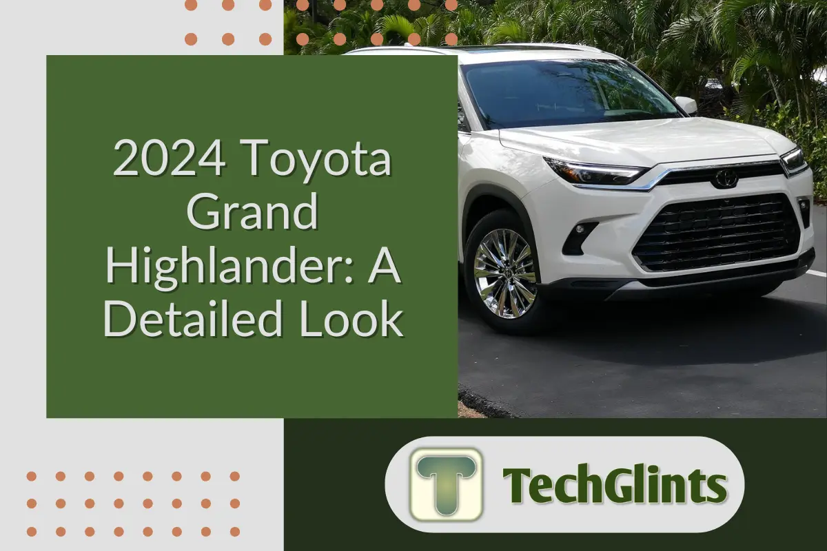 2024 Toyota Grand Highlander SUV parked on a driveway, showcasing its sleek front grille and modern design, with trees in the background.